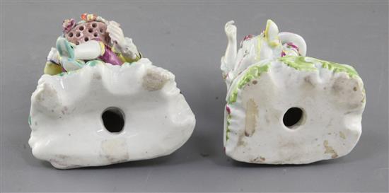 A near pair of early Derby Pale Family figures of a seated gentleman and woman, c. 1756-8, h. 13cm, slight restoration